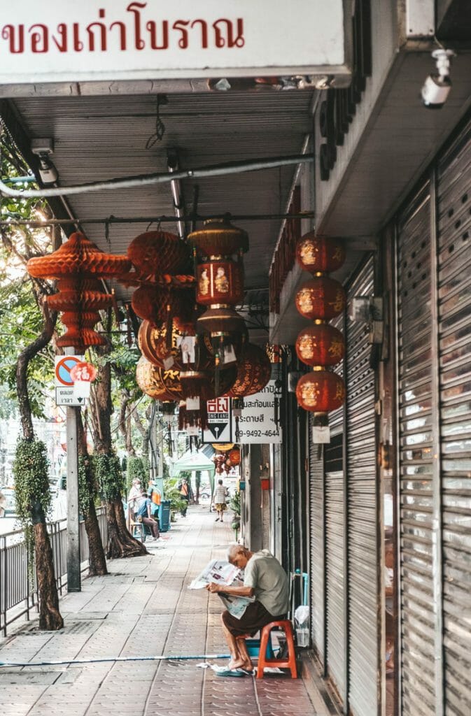 Man sitting on a stool in Chinatown