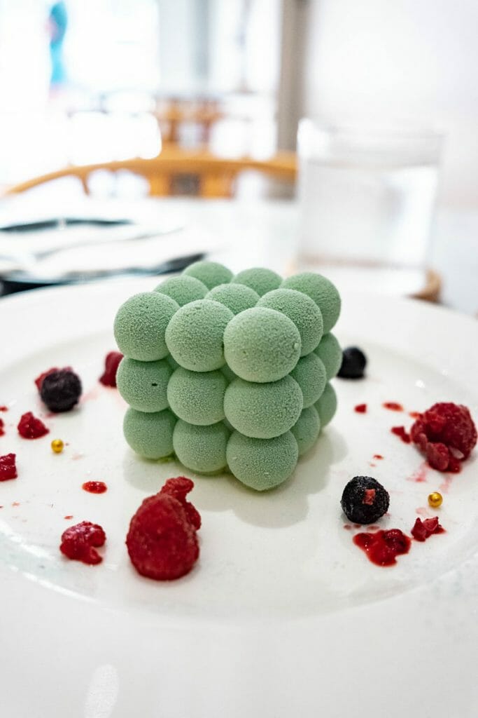 Spherecal cake on a white plate