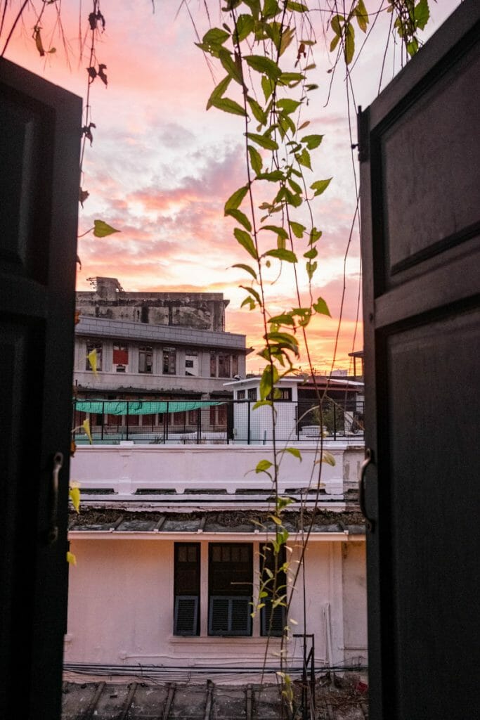 Sunrise behind open shutters