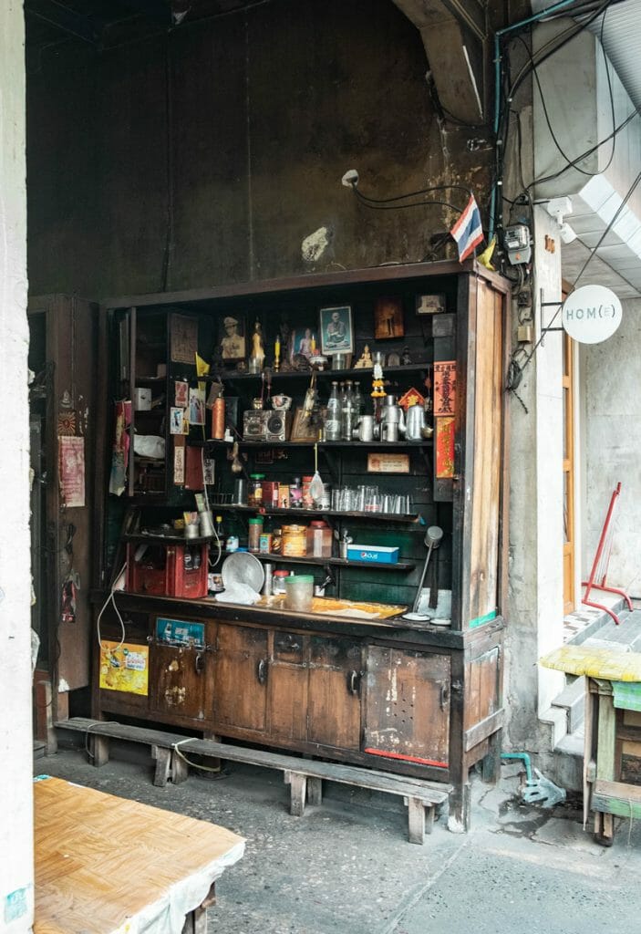 Shelf with cooking utensils in a side alley