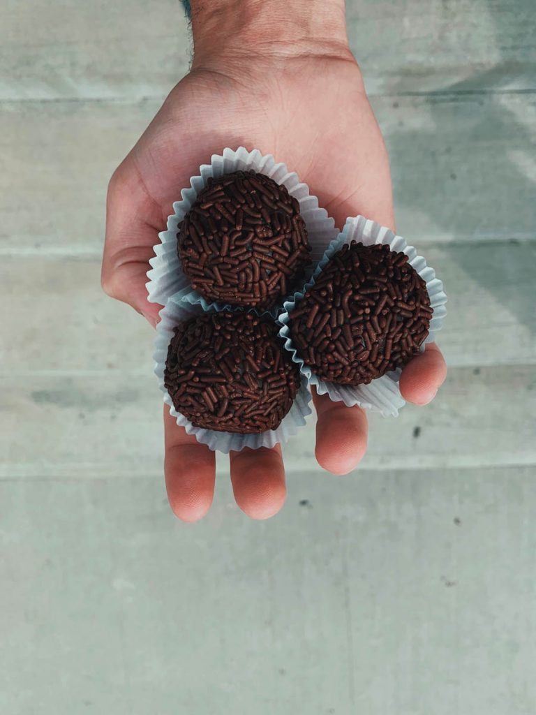 Hand holding three Brigadeiro
