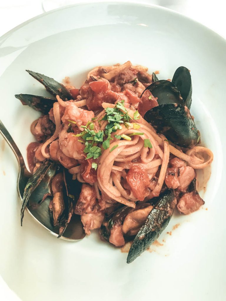 White plate with seafood pasta