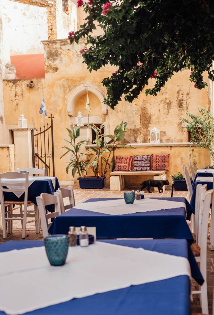 Blue tables outside at Well of the Turk restaurant