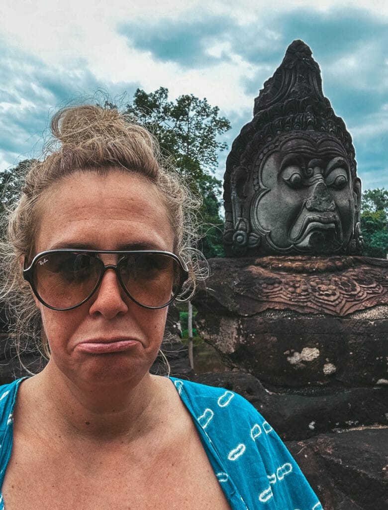 Annika Ziehen making sad demon face on bridge in Angkor Thom