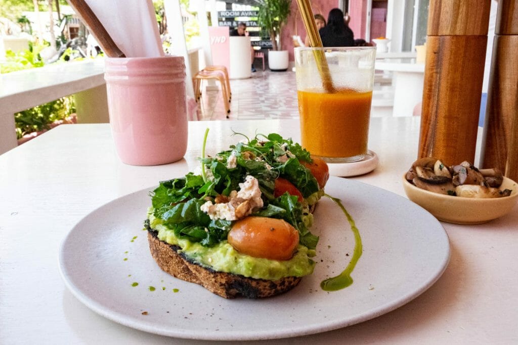 Bread with smashed avocado and Jamu at Kynd